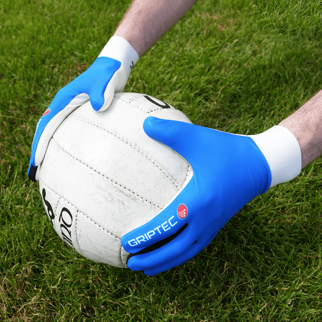 GRIPTEC Gaelic football gloves worn by a player on the pitch