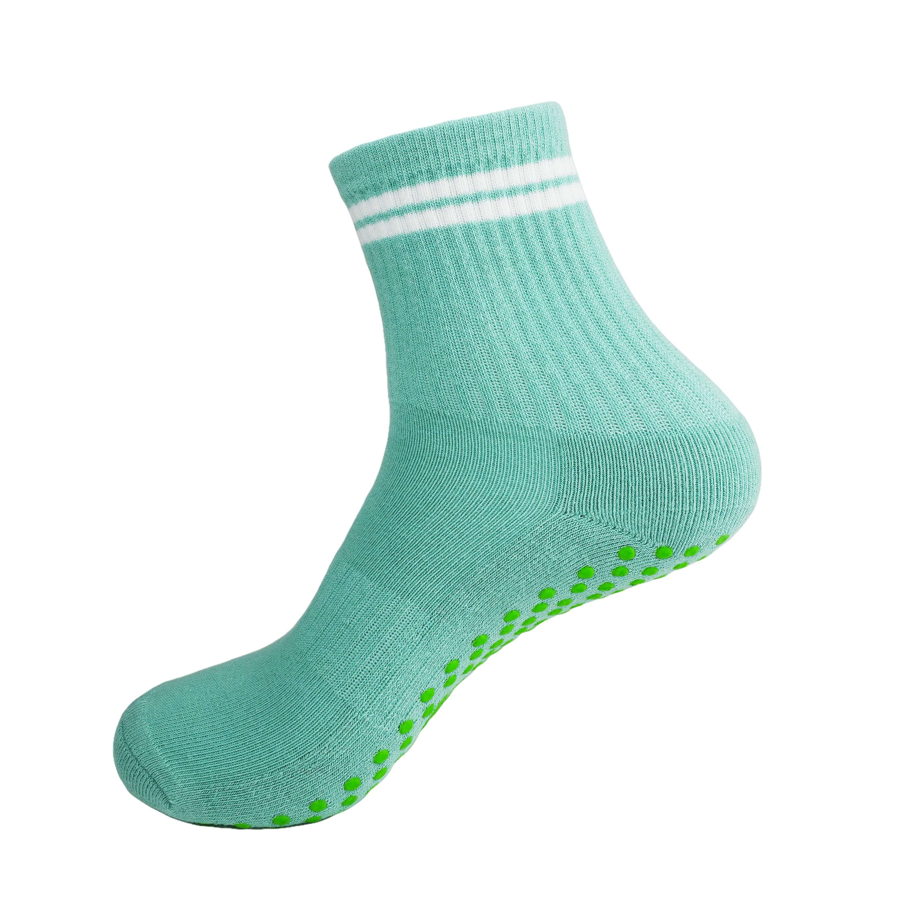 Green and white GRIPTEC pilates grip socks, side view