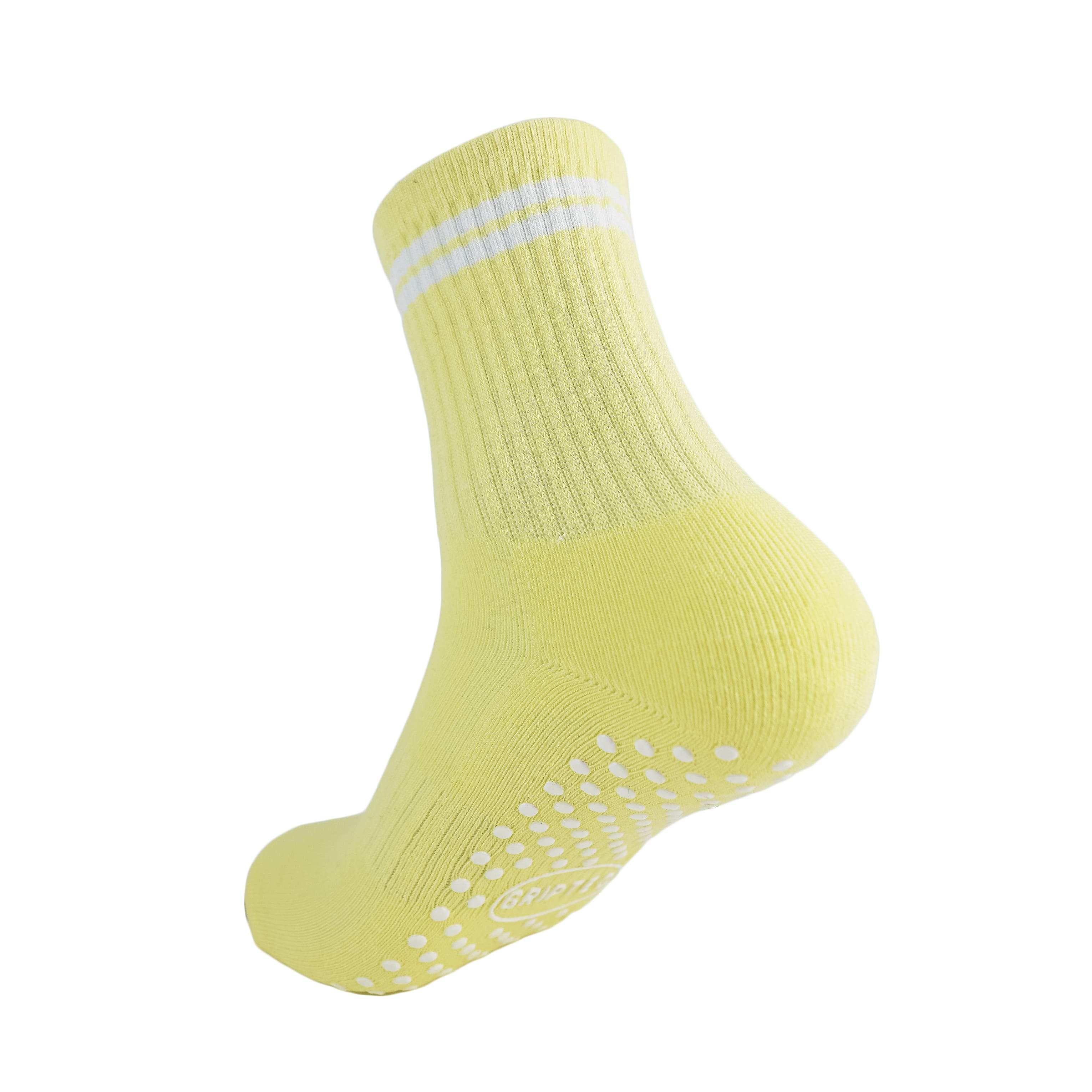 Yellow and white GRIPTEC pilates grip socks, back view showing the non-slip sole