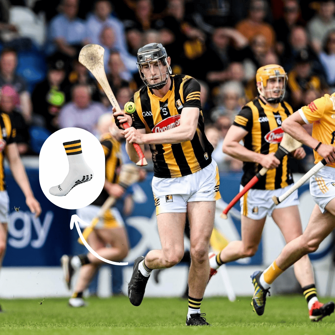 Black and amber GRIPTEC grip socks worn during a Gaelic games match