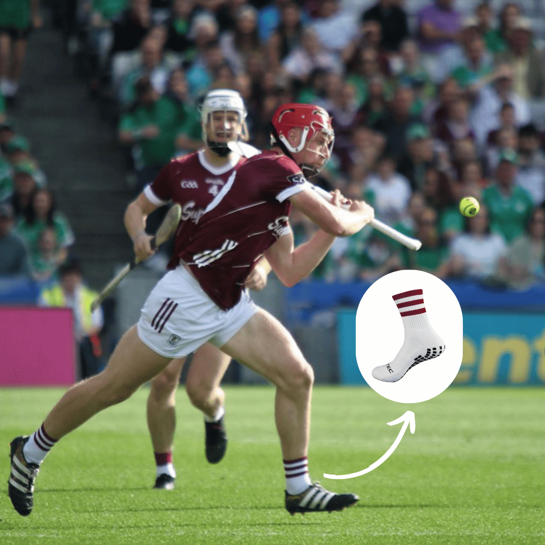 Maroon and white GRIPTEC grip socks worn during a Gaelic games match