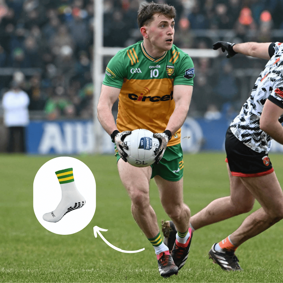 green and gold GRIPTEC grip socks worn during a Gaelic games match