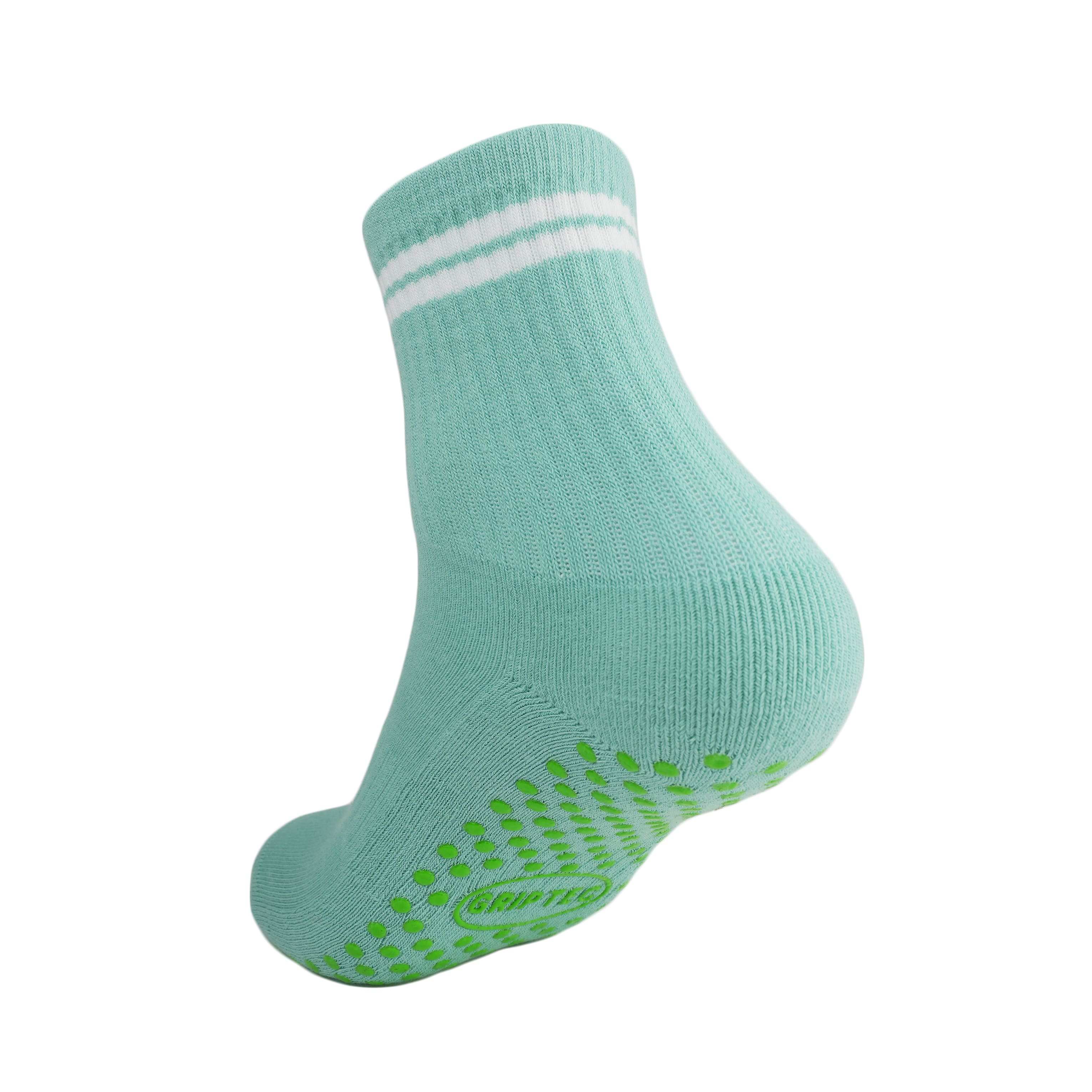 Green and white GRIPTEC pilates grip socks, back view showing the non-slip sole